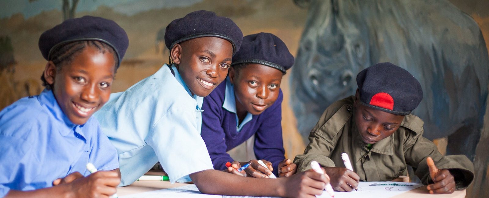 Children in Zambia learn about wildlife and are inspired to love rhino. Credit: Tristan Vince