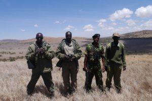 Four rangers on patrol in Kenya.