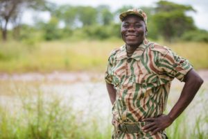 A ranger smiling. Rangers save rhinos each day.