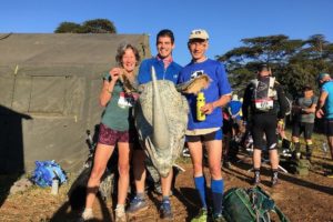 Photo of Cathy Dean, Kenneth and Oli holding the rhino costume before the For Rangers Ultra begins. 