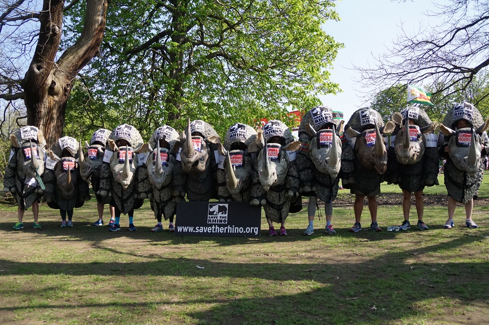 Rhino costume runners assemble before race