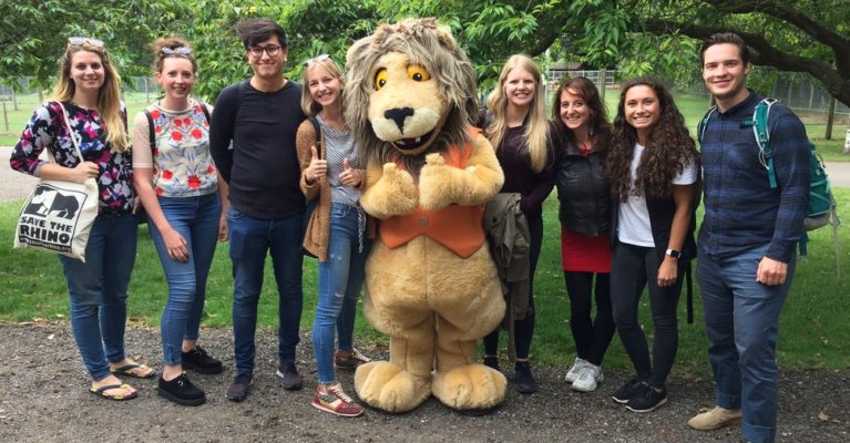 Picture of Save the Rhino team with Reggie the lion at AfricaAlive.