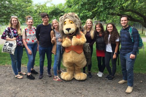 Image of Save the Rhino team with Reggie the lion at AfricaAlive!