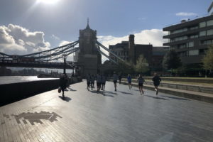 Image of runners going towards Tower Bridge, London.