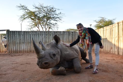Photo of Michaela with black rhino Alfie, at Ol Jogi