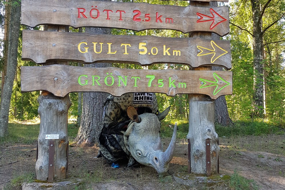 James Last underneath his charity run sign in his rhino costume