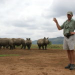 Jamie with white rhinos