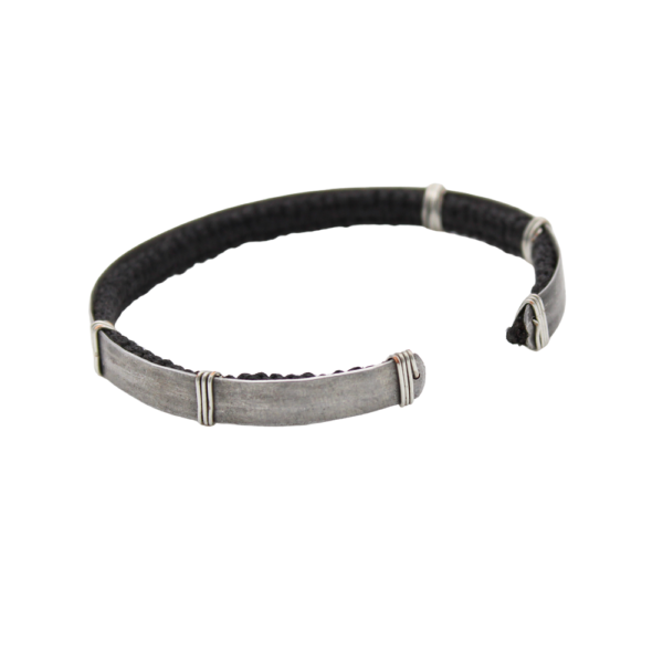 A photograph of the 'Save the Rhino' stamped bracelet taken from the back