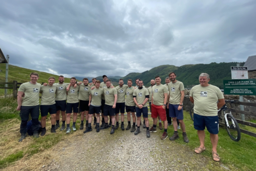 Group of men in green save the rhino t-shirts