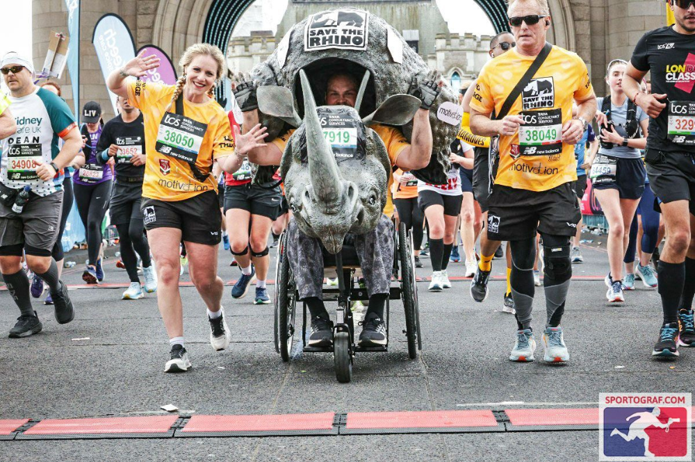 Wheelchair rhino and two runners on London Marathon