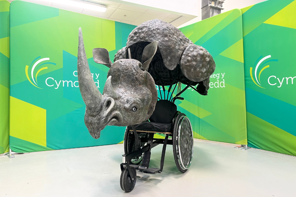 Wheelchair with rhino costume.