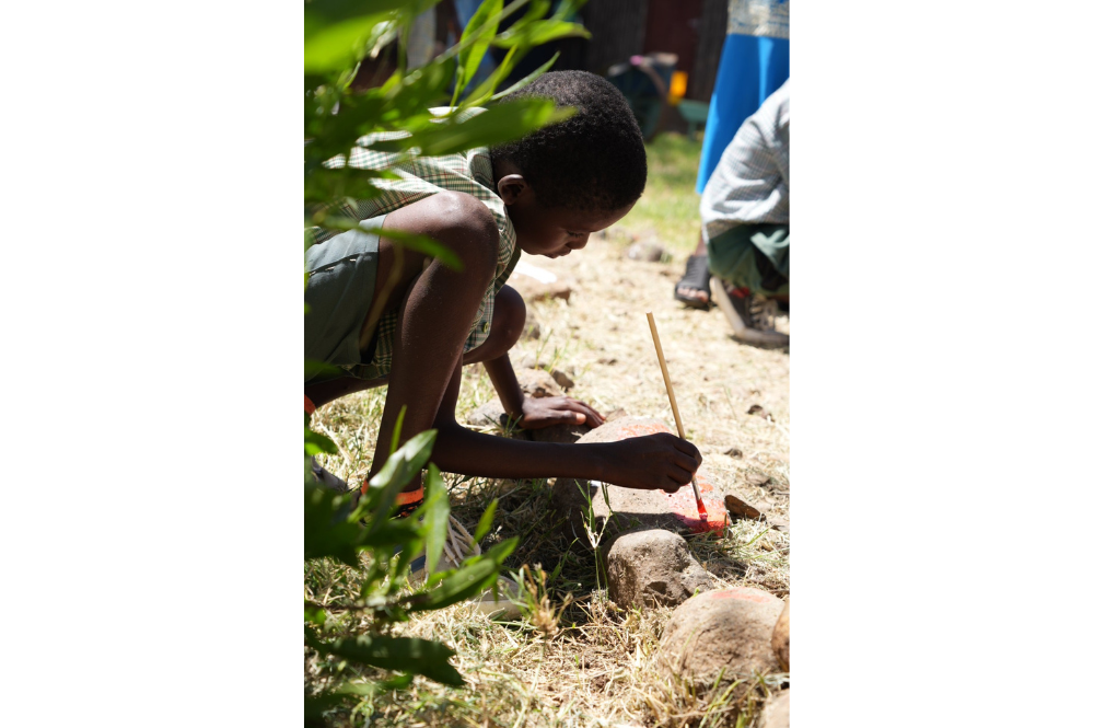 Child painting outside