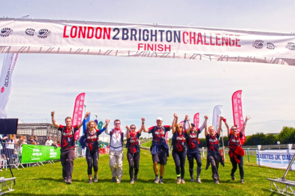 Walkers at the finish line of the London 2 Brighton Ultra Challenge