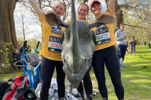 3 girls holding rhino costume head at the London Marathon
