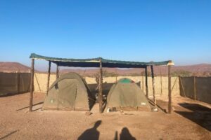 Two tents in a small base area.