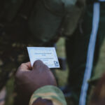 A ranger holding the message of a Primary School child from the United Kingdom